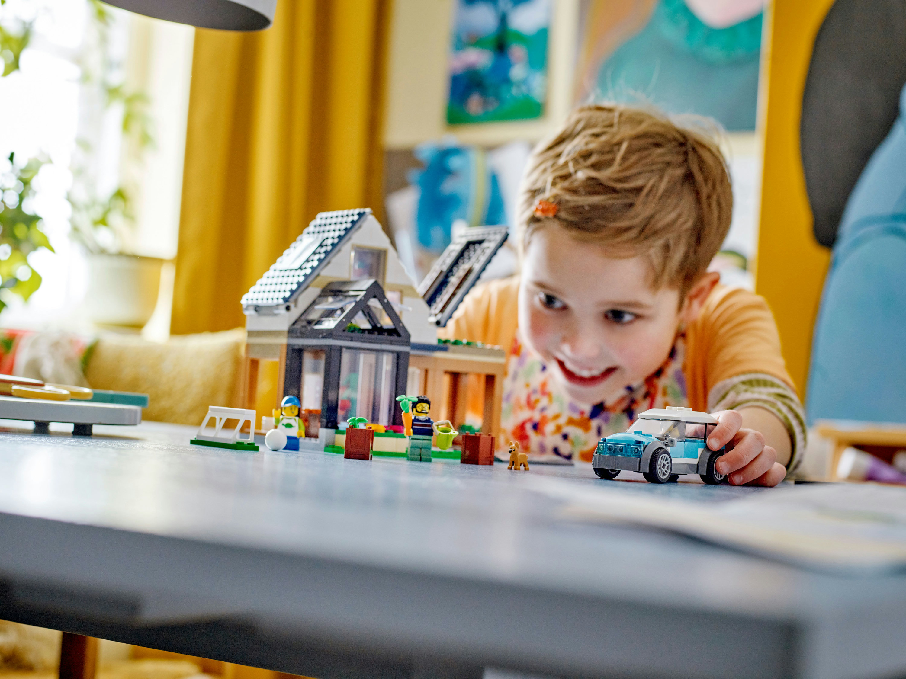 LEGO City Villetta familiare e auto elettrica