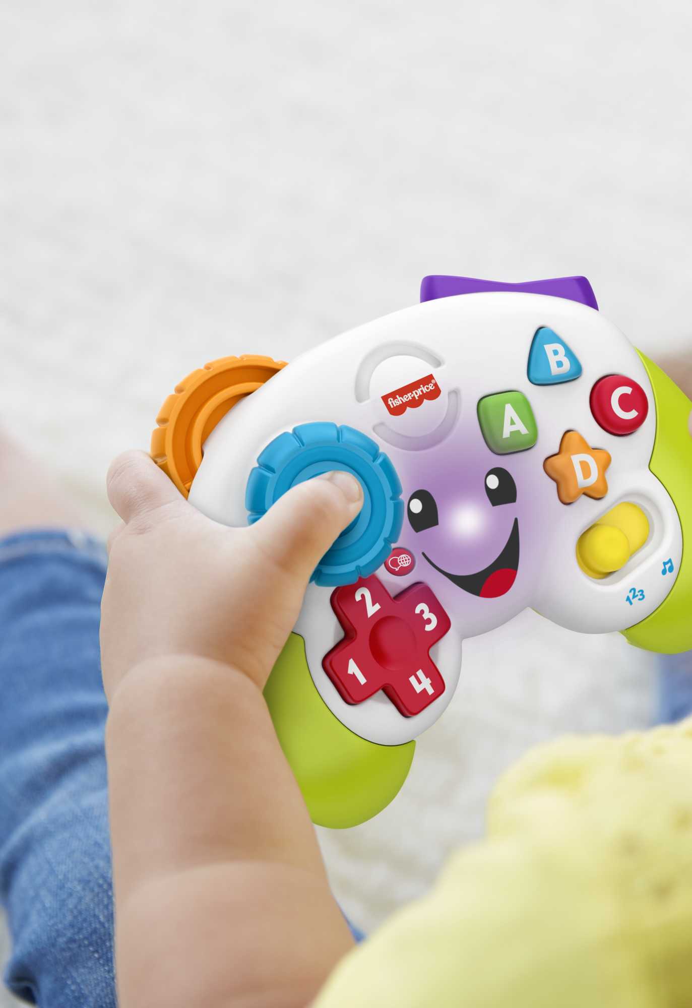 Fisher-Price Laugh & Learn Controller Gioca & Impara Ridi & Impara - Edizione multilingue, Joystick Giocattolo Musicale per l'Infanzia con Luci e Contenuti Educativi, Giocattolo per Bambini 6+ Anni