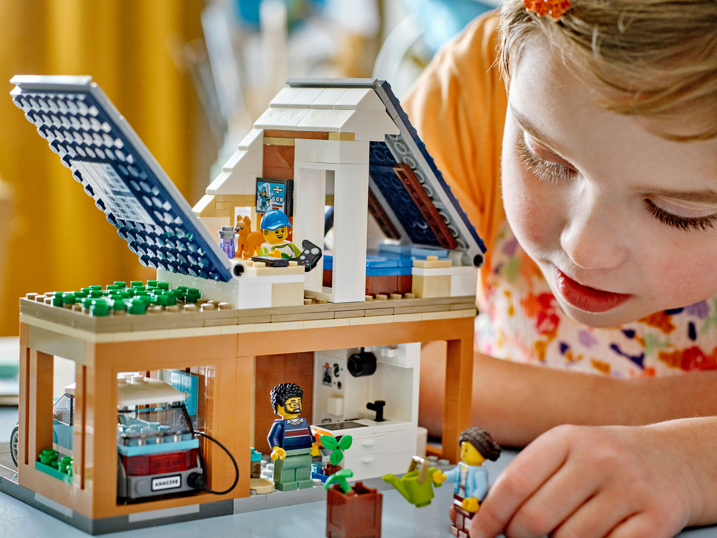 LEGO City Villetta familiare e auto elettrica